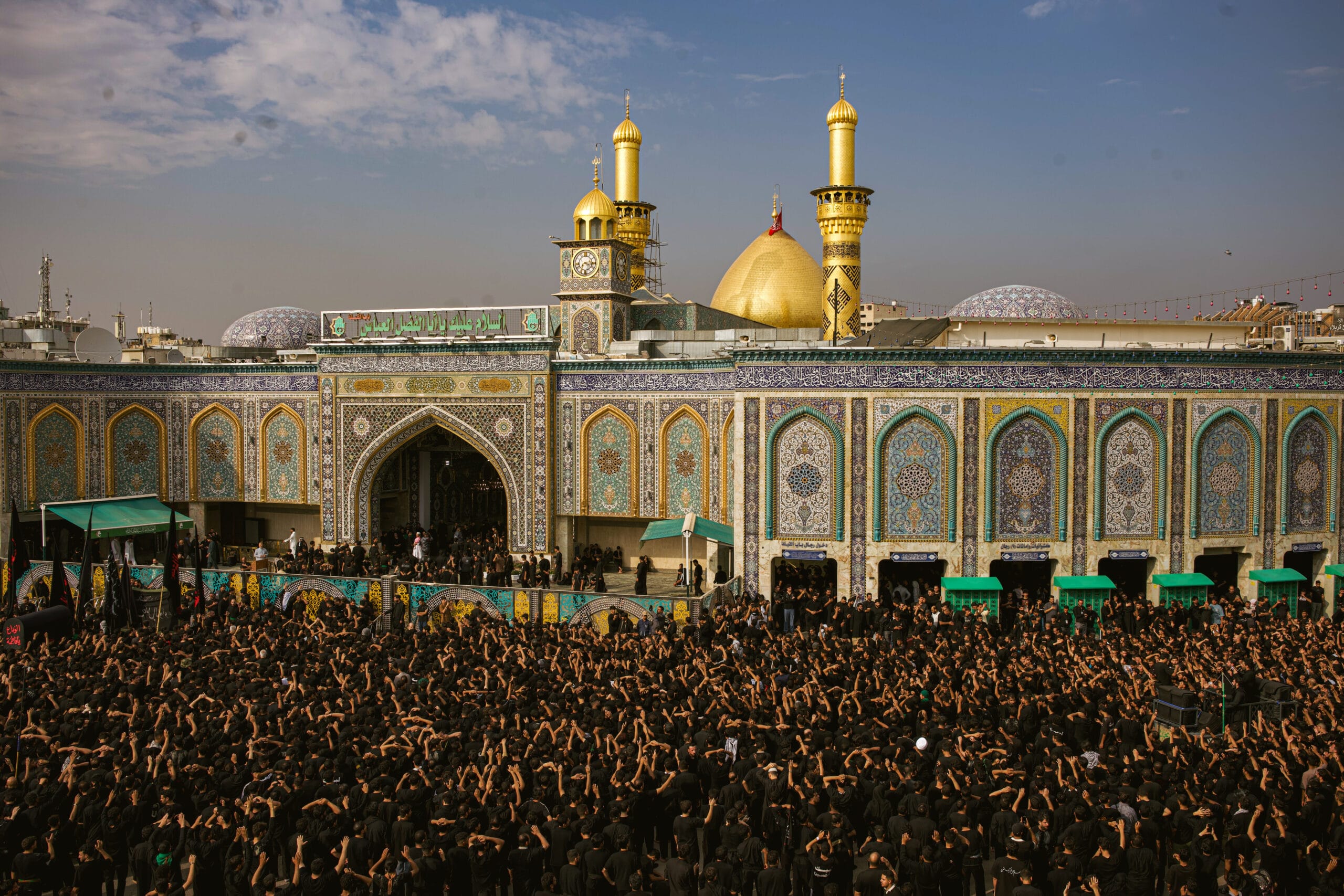 The Holy Shrine of Imam Hussain (as) lit with green celebration lights