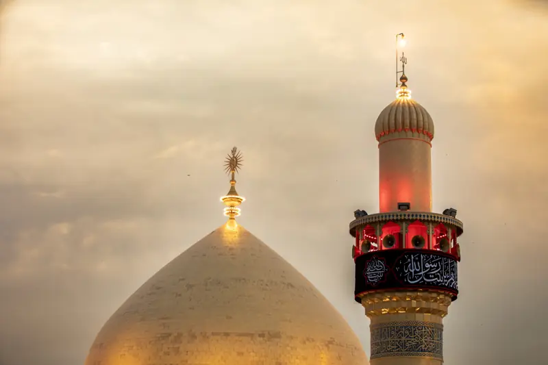 Golden dome and minaret at dusk